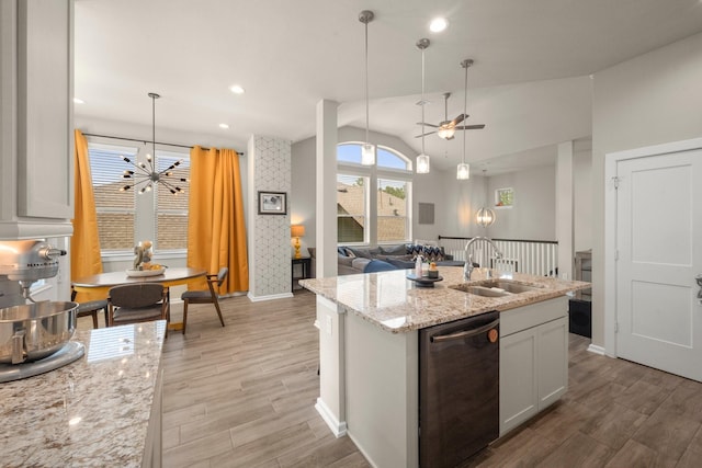 255 S Spotted Fern Dr, Montgomery, TX 77316 - kitchen with dishwasher, a sink, a chandelier, lofted ceiling, and baseboards