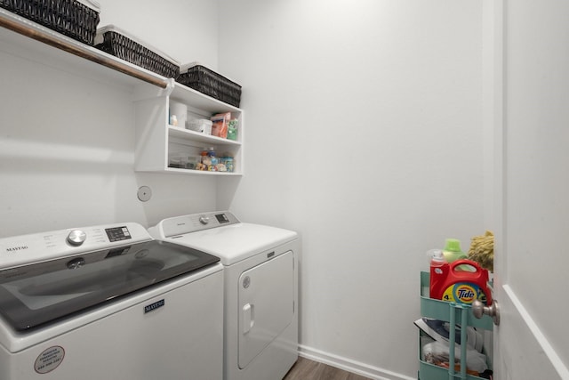 255 S Spotted Fern Dr, Montgomery, TX 77316 - laundry area featuring independent washer and dryer, wood finished floors, and baseboards