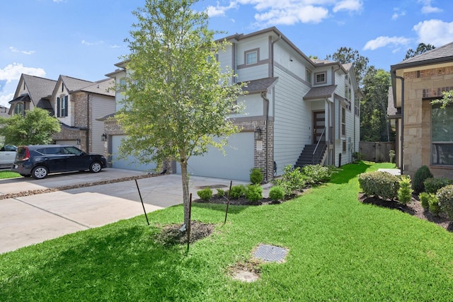255 S Spotted Fern Dr, Montgomery, TX 77316 - view of front of home with a garage, concrete driveway, and a front lawn