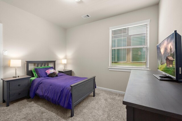 255 S Spotted Fern Dr, Montgomery, TX 77316 - bedroom featuring light colored carpet and baseboards