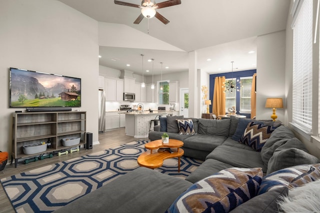255 S Spotted Fern Dr, Montgomery, TX 77316 - living area with ceiling fan, light wood-style flooring, vaulted ceiling, a chandelier, and recessed lighting