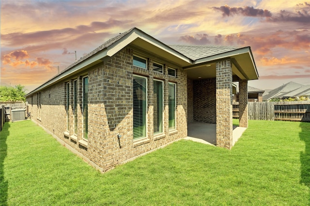 3319 Sky Run Ct, Missouri City, TX 77459 - view of home's exterior featuring brick siding and a patio area