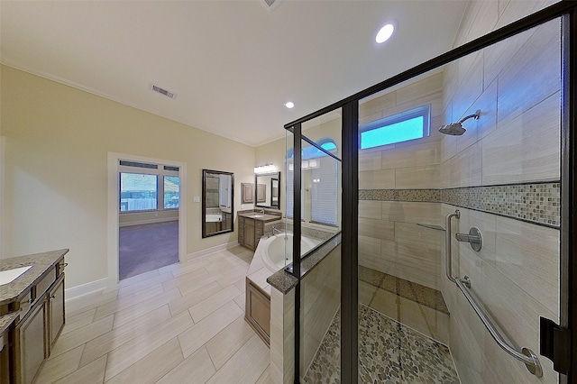 2308 Ellis Park Ln, Conroe, TX 77304 - full bath featuring a shower stall, vanity, baseboards, recessed lighting, and ornamental molding