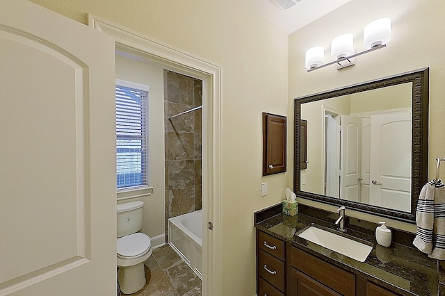 2308 Ellis Park Ln, Conroe, TX 77304 - bathroom featuring toilet, vanity, and shower / bath combination