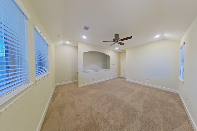 2308 Ellis Park Ln, Conroe, TX 77304 - spare room featuring vaulted ceiling, light colored carpet, recessed lighting, ceiling fan, and baseboards