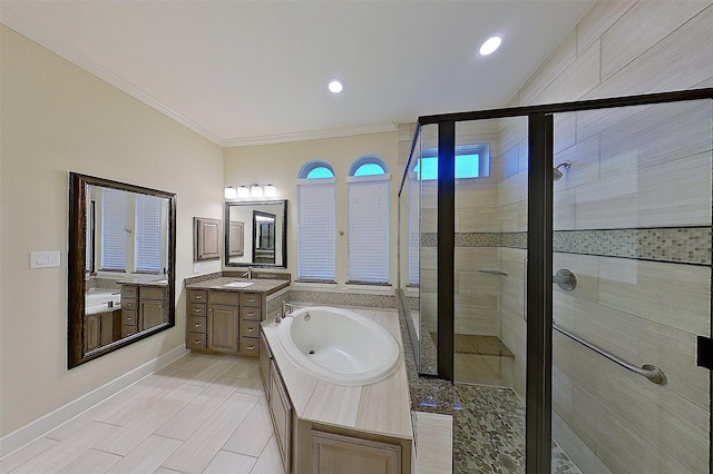 2308 Ellis Park Ln, Conroe, TX 77304 - bathroom featuring a stall shower, baseboards, a bath, crown molding, and two vanities