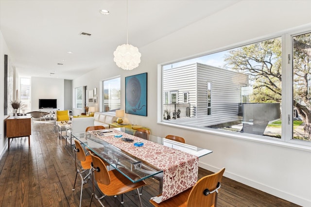 1851 Lexington St, Houston, TX 77098 - dining space featuring baseboards, hardwood / wood-style flooring, recessed lighting, and a chandelier