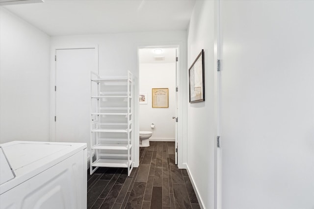 1851 Lexington St, Houston, TX 77098 - corridor featuring dark wood-style flooring, washing machine and clothes dryer, and baseboards