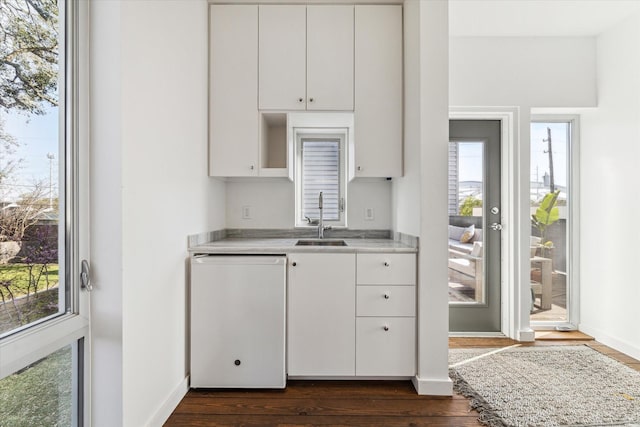 1851 Lexington St, Houston, TX 77098 - kitchen featuring a sink, dishwasher, light countertops, and plenty of natural light