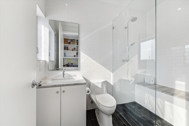 1851 Lexington St, Houston, TX 77098 - bathroom featuring tile walls, tiled shower, toilet, and vanity