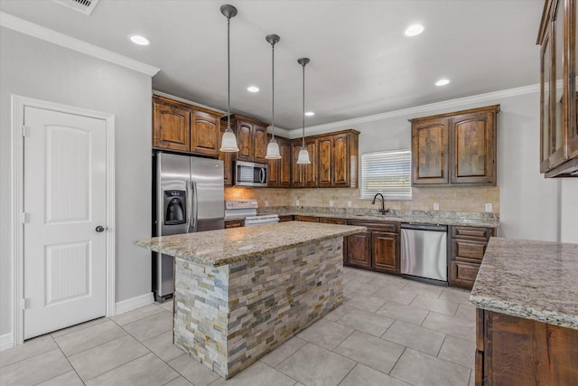 2800 Virginia Ave, League City, TX 77573 - kitchen with appliances with stainless steel finishes, a sink, tasteful backsplash, light stone countertops, and a kitchen island