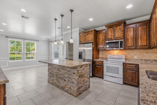 2800 Virginia Ave, League City, TX 77573 - kitchen with stainless steel appliances, ornamental molding, light tile patterned floors, tasteful backsplash, and light stone countertops