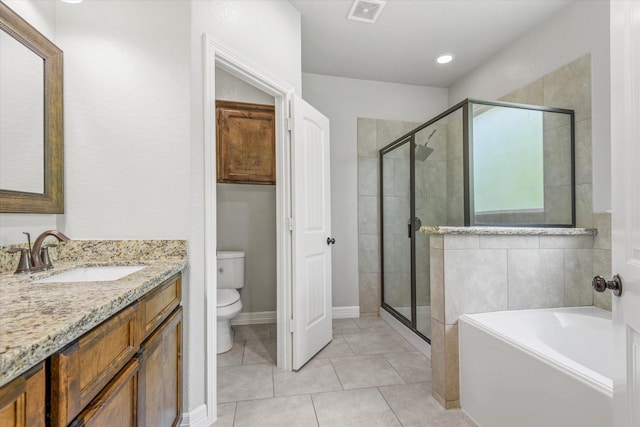 2800 Virginia Ave, League City, TX 77573 - bathroom with a shower stall, toilet, a garden tub, vanity, and tile patterned floors