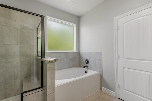 2800 Virginia Ave, League City, TX 77573 - full bathroom featuring tiled shower, a garden tub, and tile patterned floors