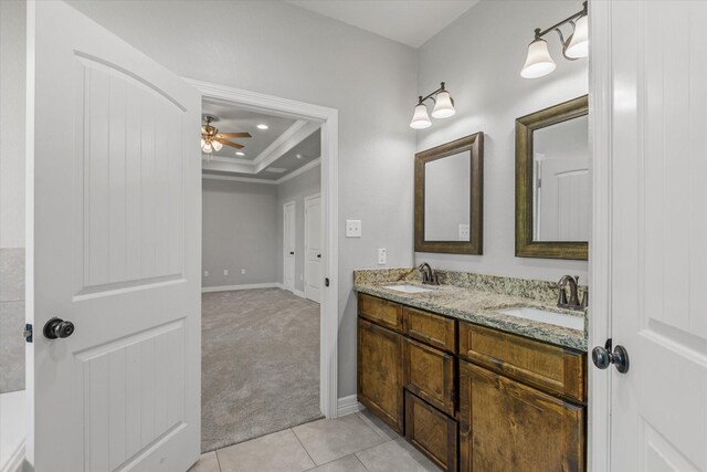 2800 Virginia Ave, League City, TX 77573 - bathroom with a raised ceiling, ornamental molding, a ceiling fan, tile patterned floors, and double vanity