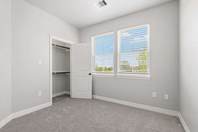 2800 Virginia Ave, League City, TX 77573 - unfurnished bedroom featuring carpet floors, baseboards, and a closet