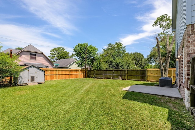 2800 Virginia Ave, League City, TX 77573 - view of yard featuring a shed, an outdoor structure, a patio, and central AC unit