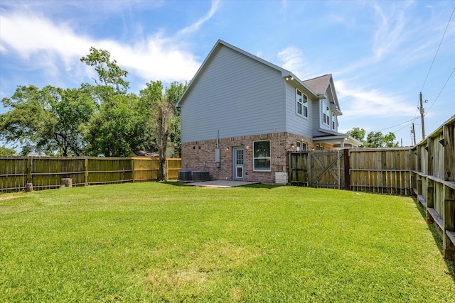 2800 Virginia Ave, League City, TX 77573 - rear view of house with brick siding, a patio area, and central AC unit