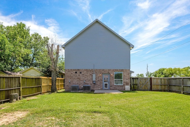 2800 Virginia Ave, League City, TX 77573 - rear view of house with brick siding, a patio, a gate, and central AC