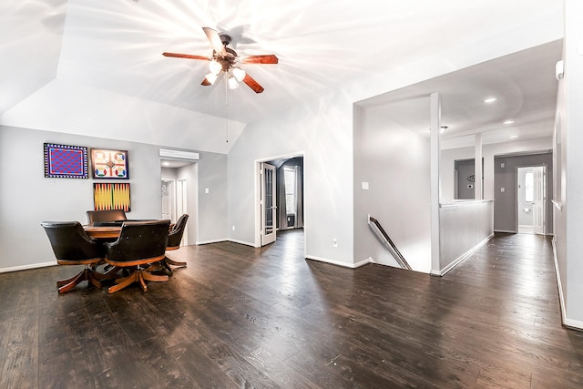 dining area featuring wood finished floors, a ceiling fan, and baseboards