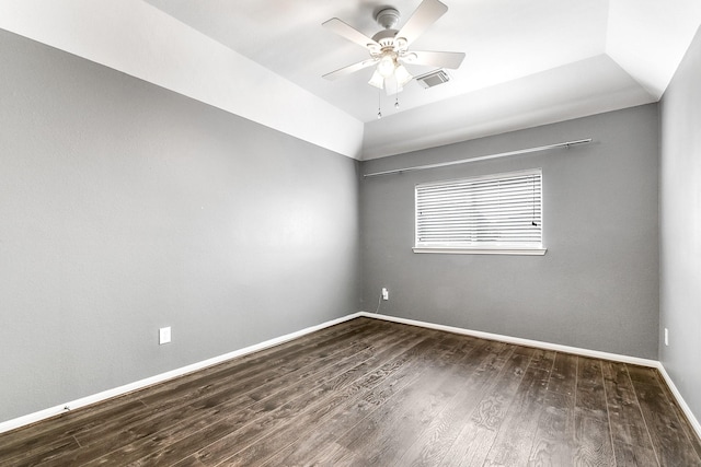 unfurnished room featuring wood finished floors, baseboards, ceiling fan, and vaulted ceiling