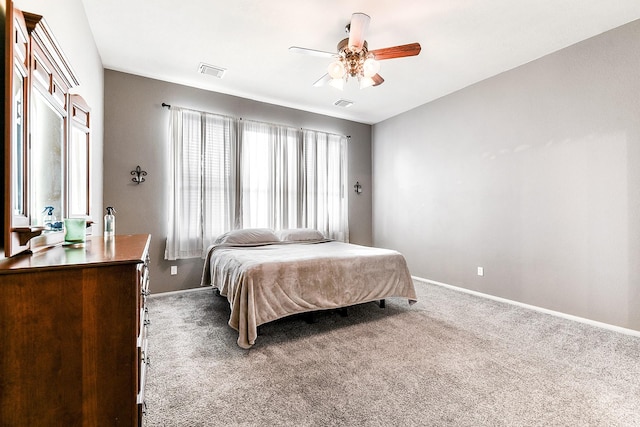 bedroom featuring carpet, baseboards, and a ceiling fan
