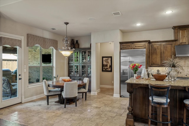 401 Bastrop Dr, Allen, TX 75013 - dining area featuring baseboards, stone tile floors, and recessed lighting