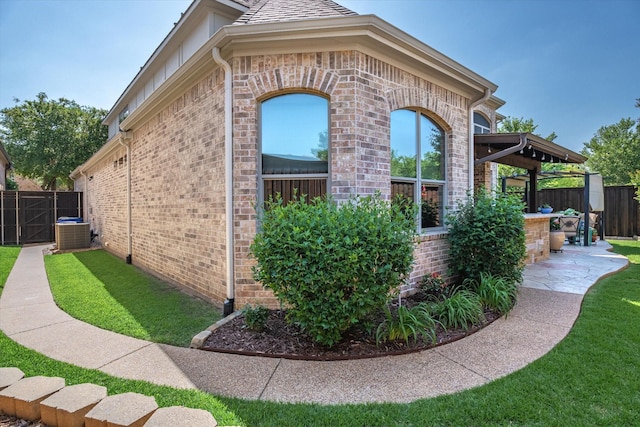 401 Bastrop Dr, Allen, TX 75013 - view of side of property featuring brick siding, central air condition unit, and a patio