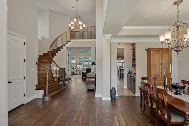 401 Bastrop Dr, Allen, TX 75013 - entryway featuring a chandelier, dark wood finished floors, stairs, ornamental molding, and a towering ceiling