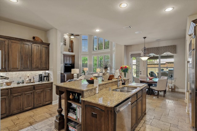 401 Bastrop Dr, Allen, TX 75013 - kitchen with dishwasher, stone tile floors, healthy amount of natural light, and recessed lighting