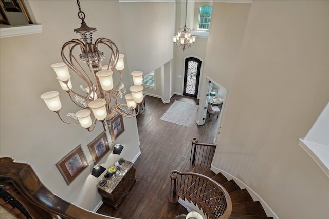 401 Bastrop Dr, Allen, TX 75013 - foyer entrance featuring a chandelier, arched walkways, plenty of natural light, wood finished floors, and a high ceiling