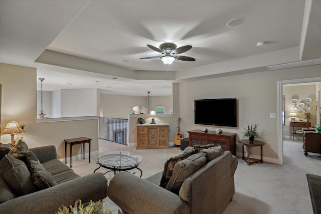 401 Bastrop Dr, Allen, TX 75013 - living area featuring light carpet, a ceiling fan, and a tray ceiling