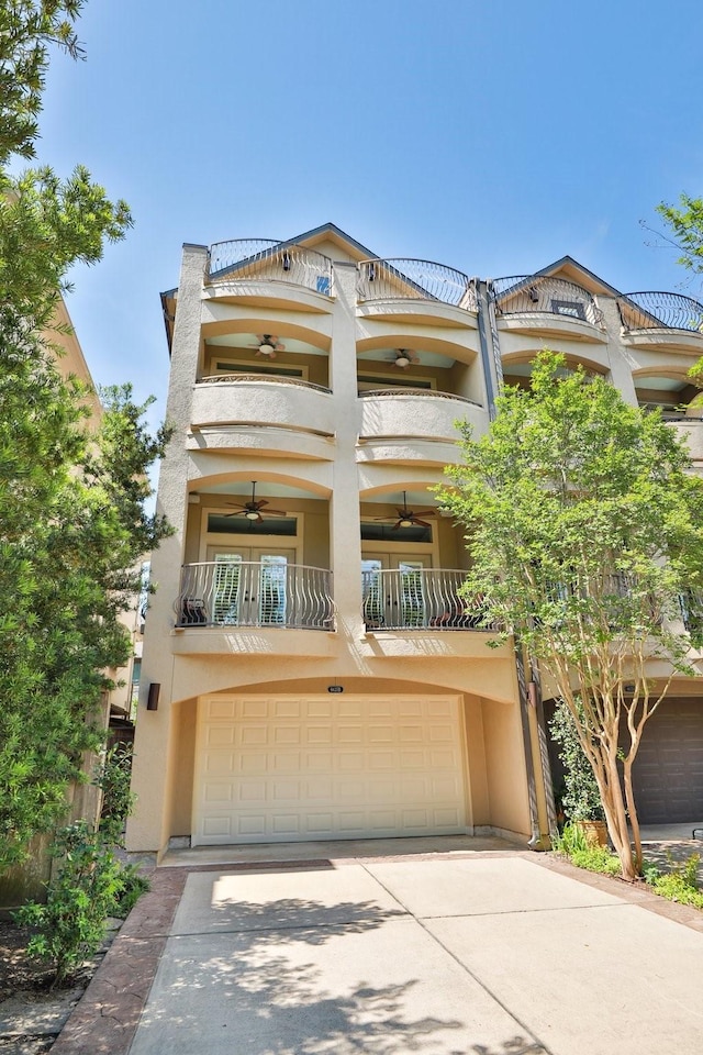 6635 Wanita Pl Unit B, Houston, TX 77007 - view of front of home featuring a balcony, stucco siding, and an attached garage
