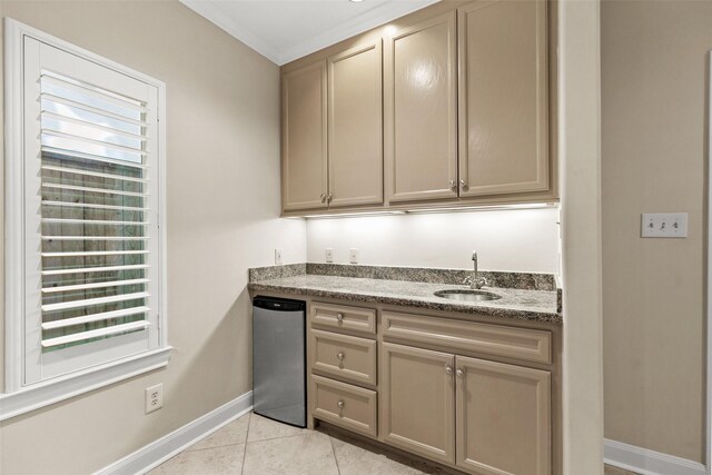 6635 Wanita Pl Unit B, Houston, TX 77007 - kitchen with a sink, baseboards, light tile patterned floors, fridge, and crown molding