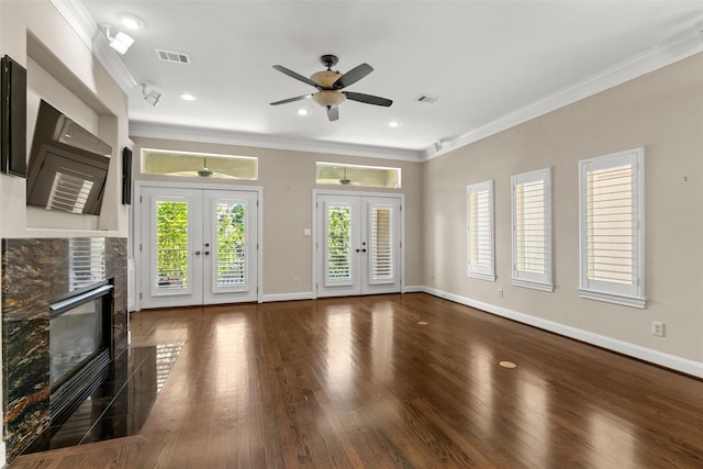 6635 Wanita Pl Unit B, Houston, TX 77007 - unfurnished living room featuring french doors, crown molding, a stone fireplace, a ceiling fan, and baseboards