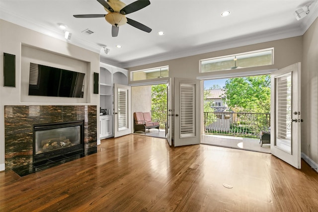 6635 Wanita Pl Unit B, Houston, TX 77007 - unfurnished living room featuring ornamental molding, a stone fireplace, ceiling fan, wood finished floors, and recessed lighting