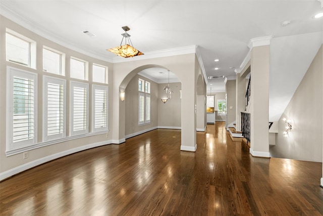 6635 Wanita Pl Unit B, Houston, TX 77007 - unfurnished living room with arched walkways, healthy amount of natural light, ornamental molding, wood finished floors, and baseboards