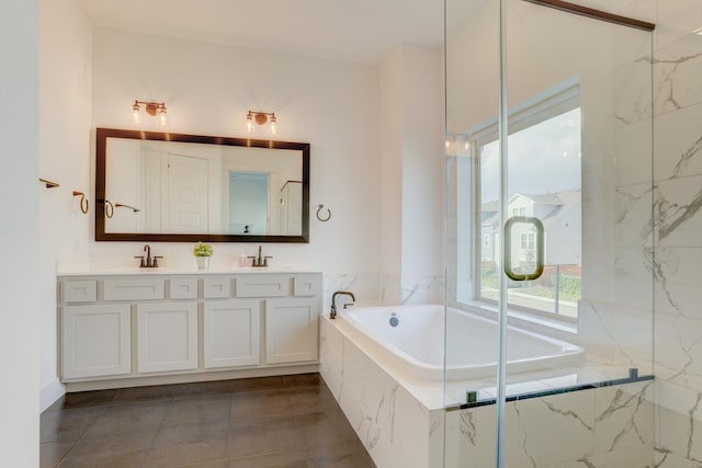 10920 Keaton Landing Dr, Houston, TX 77043 - full bathroom with double vanity, a garden tub, and tile patterned flooring