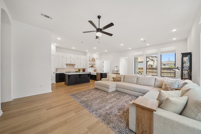 30246 Gold Finch Pl, Fulshear, TX 77441 - living room with a ceiling fan, light wood-style floors, and recessed lighting