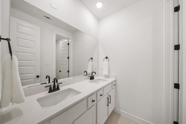 30246 Gold Finch Pl, Fulshear, TX 77441 - bathroom with baseboards, double vanity, and tile patterned floors