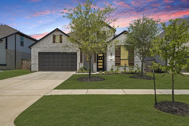 30246 Gold Finch Pl, Fulshear, TX 77441 - view of front of property with concrete driveway, a garage, and brick siding