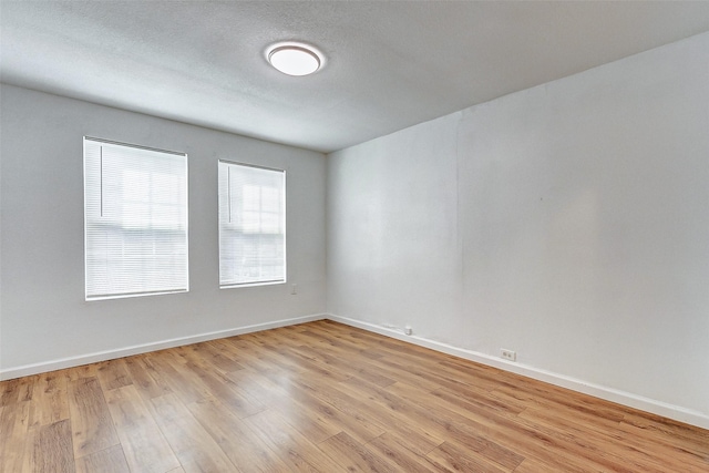 1316 Bailey St, Wharton, TX 77488 - spare room featuring light wood finished floors and baseboards