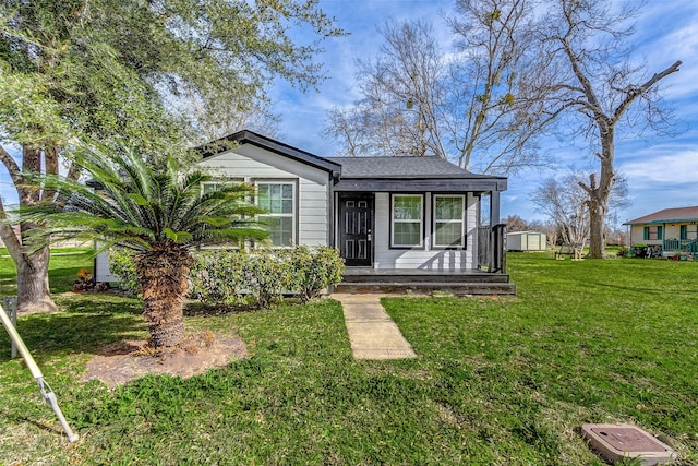 1316 Bailey St, Wharton, TX 77488 - view of front of property featuring a porch and a front yard