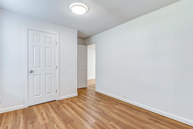 1316 Bailey St, Wharton, TX 77488 - unfurnished bedroom with light wood-style floors and baseboards