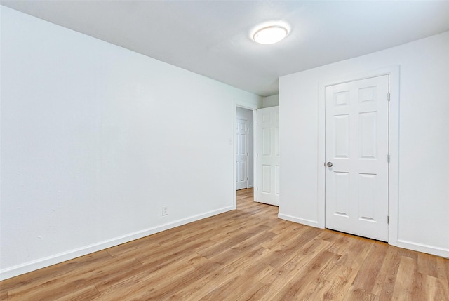 1316 Bailey St, Wharton, TX 77488 - unfurnished bedroom featuring light wood finished floors and baseboards