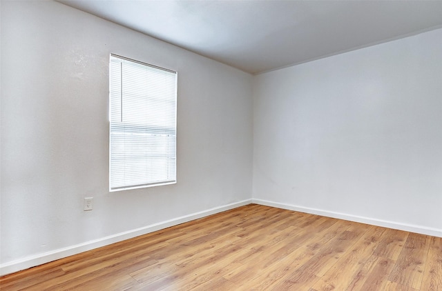 1316 Bailey St, Wharton, TX 77488 - unfurnished room with light wood-type flooring and baseboards