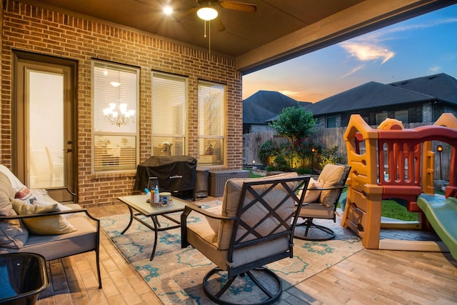 510 Blossom Cove Ct, Pinehurst, TX 77362 - patio terrace at dusk featuring an outdoor living space, fence, ceiling fan, and grilling area
