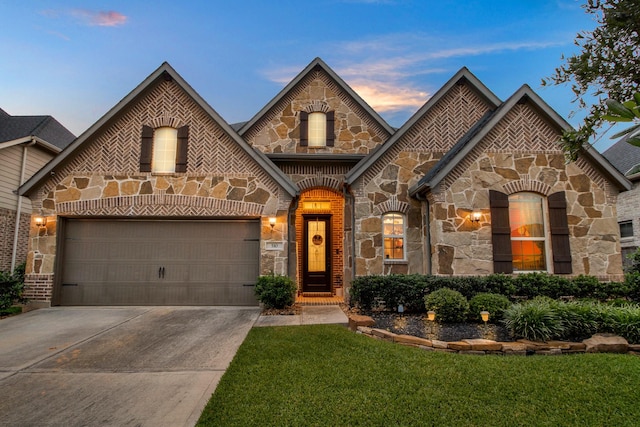 510 Blossom Cove Ct, Pinehurst, TX 77362 - french provincial home with stone siding, driveway, a garage, and a front yard