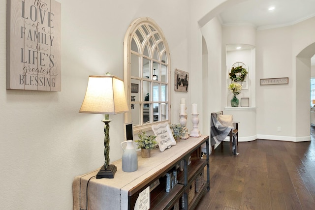 510 Blossom Cove Ct, Pinehurst, TX 77362 - hall with arched walkways, ornamental molding, dark wood finished floors, baseboards, and recessed lighting