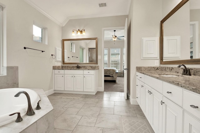 510 Blossom Cove Ct, Pinehurst, TX 77362 - bathroom with a ceiling fan, crown molding, baseboards, a garden tub, and two vanities
